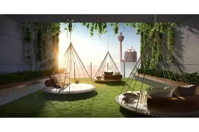 two swings in a room with a view of a city at Ceylonz Suites Bukit Bintang by KL ONE in Kuala Lumpur
