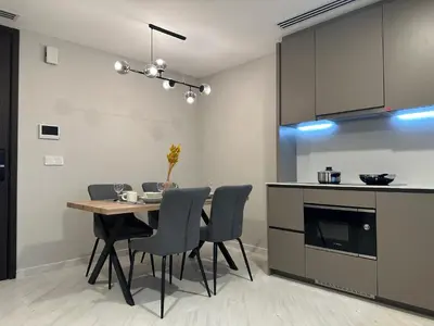 a kitchen and dining room with a table and chairs at Eaton Residences KLCC by Romeo Bnb in Kuala Lumpur