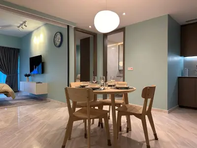 a dining room with a table and chairs at Eaton Residences KLCC by Romeo Bnb in Kuala Lumpur