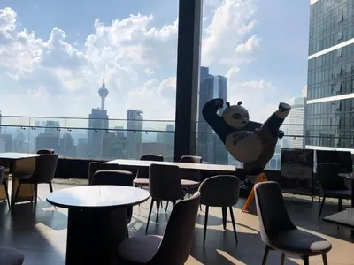 a teddy bear balloon in a restaurant with tables and chairs at 8 Kia Peng Suites KLCC by Luna in Kuala Lumpur