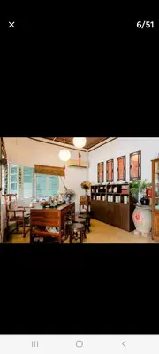 a dining room with a table and some chairs at Ming Yuan Homestay in Kuala Lumpur