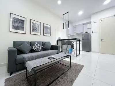 a living room with a couch and a table at Arte Mont Kiara by Yan Yee in Kuala Lumpur