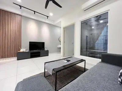 a living room with a couch and a tv at Arte Mont Kiara by Yan Yee in Kuala Lumpur