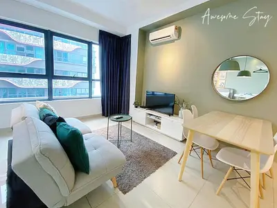 a living room with a couch and a table and a mirror at Arte Plus Ampang in Kuala Lumpur
