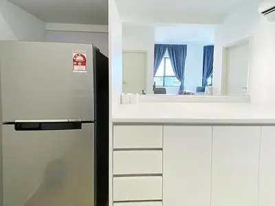 a kitchen with a refrigerator and a mirror at Arte Plus Ampang in Kuala Lumpur