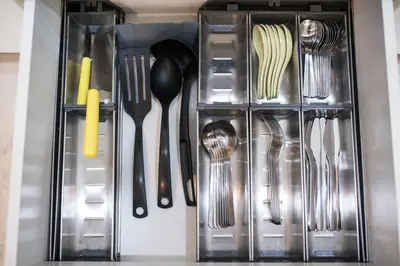 a drawer filled with utensils in a kitchen at Soho Suites KLCC by Minsha in Kuala Lumpur