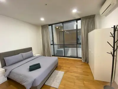 a bedroom with a bed and a large window at KL Gateway Penthouse by Cobnb - 10Pax in Kuala Lumpur