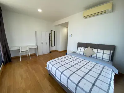 a bedroom with a bed and a desk in it at KL Gateway Penthouse by Cobnb - 10Pax in Kuala Lumpur