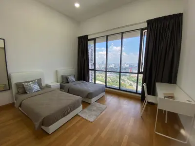 a bedroom with two beds and a large window at KL Gateway Penthouse by Cobnb - 10Pax in Kuala Lumpur