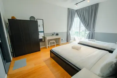 a bedroom with two beds and a large window at Inspirasi@Mont Kiara in Kuala Lumpur
