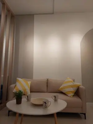 a living room with a couch and a coffee table at Chambers Platinum Suite Kuala Lumpur in Kuala Lumpur