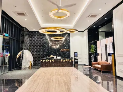 a store lobby with a table and a chandelier at Chambers Platinum Suite Kuala Lumpur in Kuala Lumpur