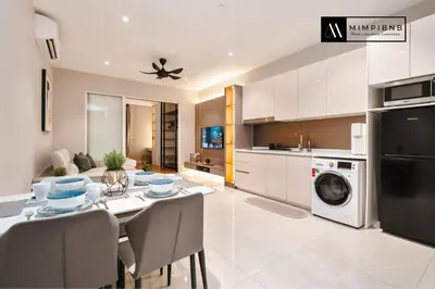 a kitchen and dining room with a table and chairs at Quill Residences Suite by Mimpi B&B in Kuala Lumpur