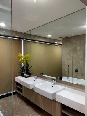 a bathroom with two sinks and a large mirror at Luxurious Staycation Apartment in Ampang