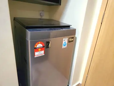 a trash can in a room with stickers on it at Wisma Infinitum Studio 5\u5206\u949f\u62b5\u8fbe KL \u5e02\u4e2d\u5fc3 in Kuala Lumpur