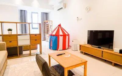 a living room with a tv and a table at VIVO at 9 Seputeh by Airhost in Kuala Lumpur
