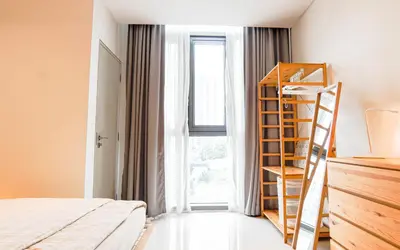 a bedroom with a ladder next to a window at VIVO at 9 Seputeh by Airhost in Kuala Lumpur