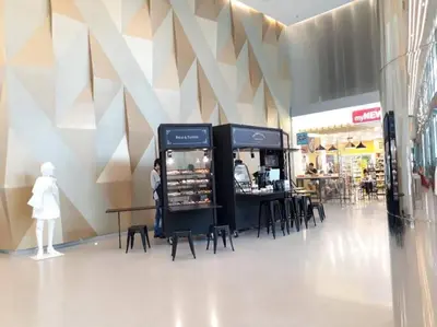 a store with two vending machines in a mall at Mercu Summer Suites Klcc by Luxe Residence in Kuala Lumpur