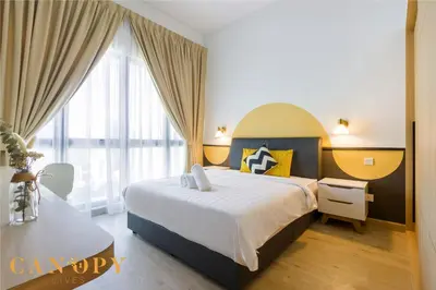 a bedroom with a bed and a large window at The Luxe & The Colony, KLCC in Kuala Lumpur