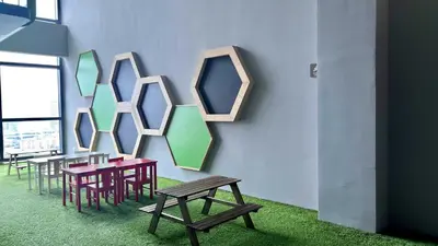 a room with tables and chairs and mirrors on the wall at Suites TribecaTRX Kuala Lumpur by ZenGlo 5min walk to The Exchange TRX in Kuala Lumpur