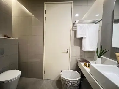 a bathroom with a toilet and a sink at Suites TribecaTRX Kuala Lumpur by ZenGlo 5min walk to The Exchange TRX in Kuala Lumpur