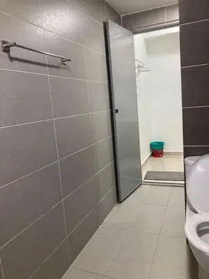 a bathroom with a shower stall and a toilet at Nour Homestay KLCC View - COZY 2 in Kuala Lumpur