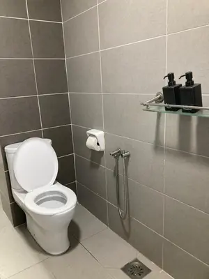 a bathroom with a toilet and a shower at Nour Homestay KLCC View - COZY 2 in Kuala Lumpur