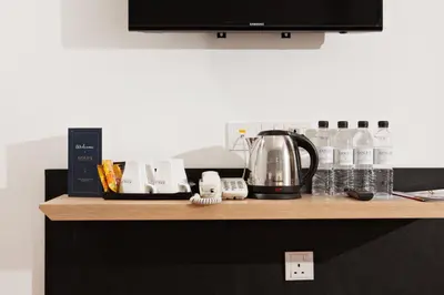 a counter top with a coffee maker on it at Gold3 Boutique Hotel in Kuala Lumpur