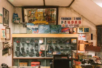 a shop with a lot of items on the wall at Gold3 Boutique Hotel in Kuala Lumpur