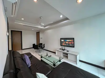 a living room with a couch and a flat screen tv at BBHomes at Casa Residency KL in Kuala Lumpur