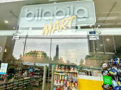 a store with a reflection of a city in the window at family suite Laville#velocity maluri by Homeizing in Kuala Lumpur