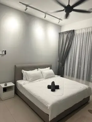 a bedroom with a bed with a hat on it at family suite Laville#velocity maluri by Homeizing in Kuala Lumpur