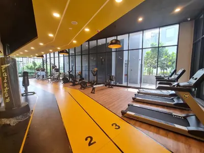 a gym with treadmills and elliptical machines at Blue Small Studio Near KLCC in Kuala Lumpur