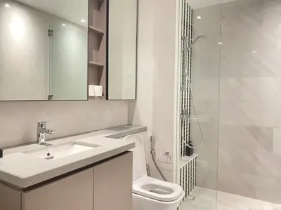 a bathroom with a toilet and a sink and a shower at Eaton Suites KLCC Kuala Lumpur in Kuala Lumpur