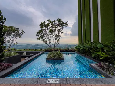 a swimming pool in the middle of a building at Riveria City KL Sentral by Sky Pool Minshuku in Kuala Lumpur