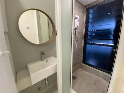 a bathroom with a sink and a mirror at Regalia Resident by Great Stay in Kuala Lumpur