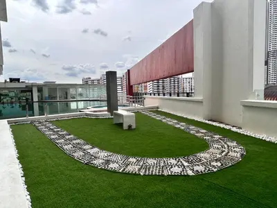 a building with a garden on the roof at Private Jacuzzi Suite - Pertama Residency in Kuala Lumpur