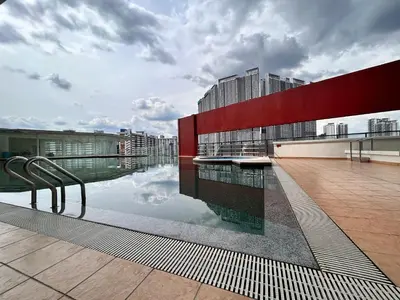 a pool on the roof of a building at Private Jacuzzi Suite - Pertama Residency in Kuala Lumpur
