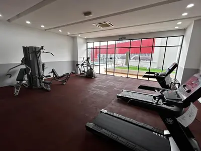 a gym with treadmills and cardio machines in a room at Private Jacuzzi Suite - Pertama Residency in Kuala Lumpur