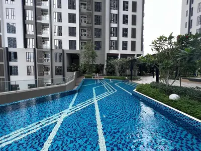 a swimming pool in the middle of a building at Sentral Suites Kuala lumpur By Leyla 3BR suites 8 pax in Kuala Lumpur