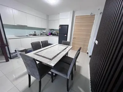 a kitchen with a table and chairs in a room at Sentral Suites Kuala lumpur By Leyla 3BR suites 8 pax in Kuala Lumpur