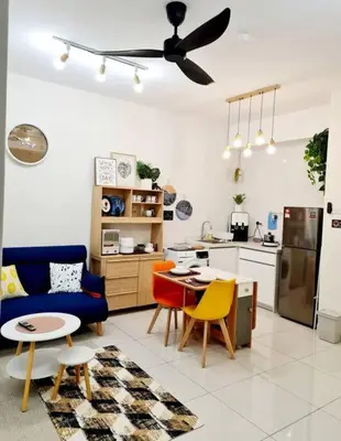 a kitchen and living room with a table and chairs at Best Affordable Homestay, Arte Mont Kiara, KL in Kuala Lumpur