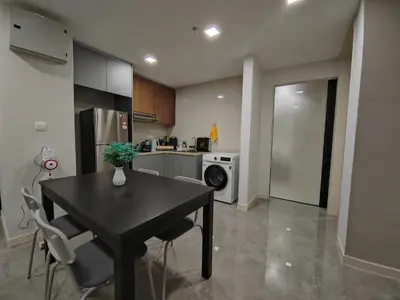 a kitchen with a black table and chairs in a room at The Ooak Mont Kiara 33A# Main Street Sunway 163#1 bedroom 1-2Pax in Kuala Lumpur