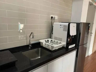 a kitchen counter with a sink and a coffee maker at Menara Arina Uniti in Kuala Lumpur