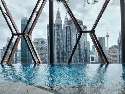 a swimming pool with a view of the city at Luxury Apartment at Scarletz Suites Kuala Lumpur in Kuala Lumpur