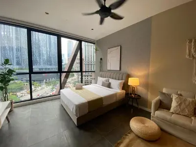 a bedroom with a bed and a ceiling fan at Luxury Apartment at Scarletz Suites Kuala Lumpur in Kuala Lumpur