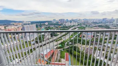 a view of a city from the balcony of a building at 3A YOLO Budget Condo in Kuala Lumpur