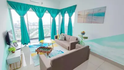 a living room with blue curtains and a couch at 3A YOLO Budget Condo in Kuala Lumpur