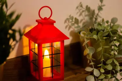a red lantern sitting on top of a table at KL 9Pax 10Mins to Sentul LRT, Batu Caves, MCD (Zena Suites) in Kuala Lumpur