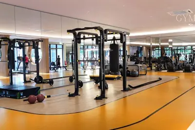 a gym with a bunch of exercise equipment in it at M Vertica Residences@KL in Kuala Lumpur